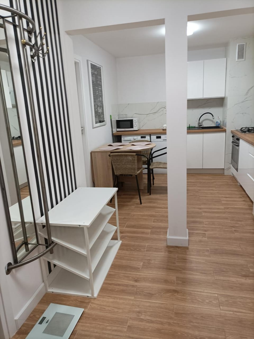 Kitchen or kitchenette, dishwasher, oven, stove