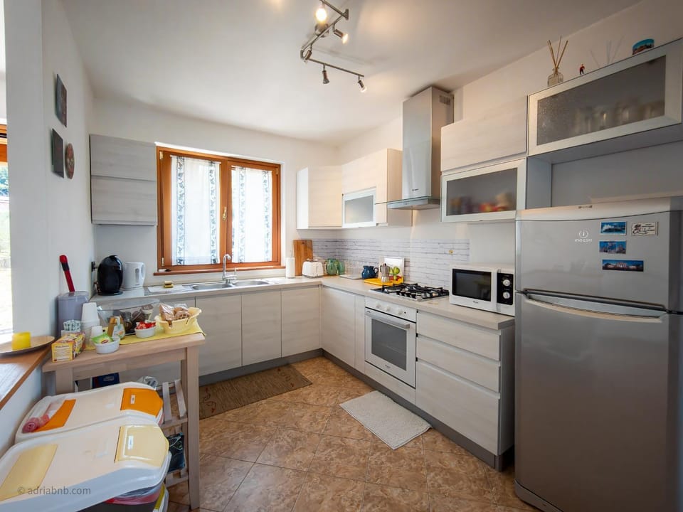 Kitchen or kitchenette, oven, stove, toaster