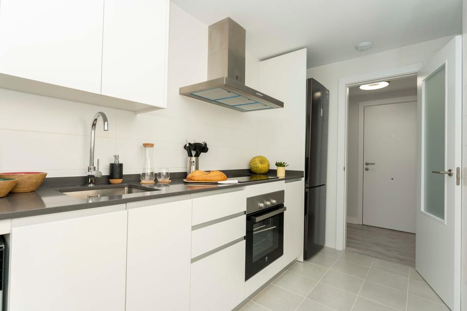Kitchen or kitchenette, dishwasher, oven, stove