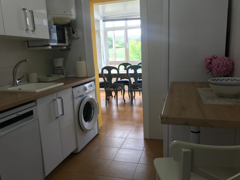 Kitchen or kitchenette, dishwasher, oven, stove, toaster, washing machine