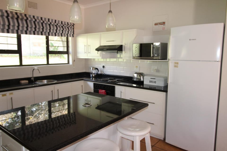 Kitchen or kitchenette, oven, stove, toaster