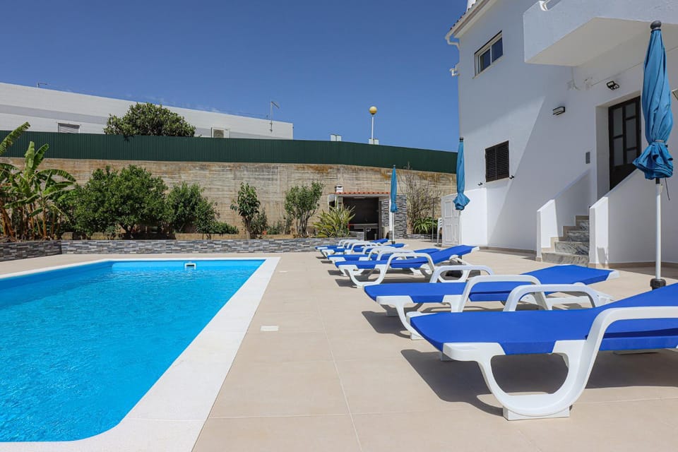 Swimming pool, sunbed