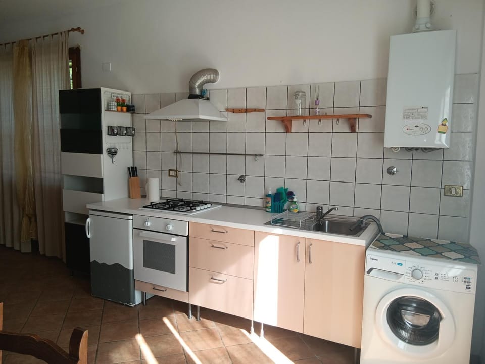Kitchen or kitchenette, oven, stove, washing machine