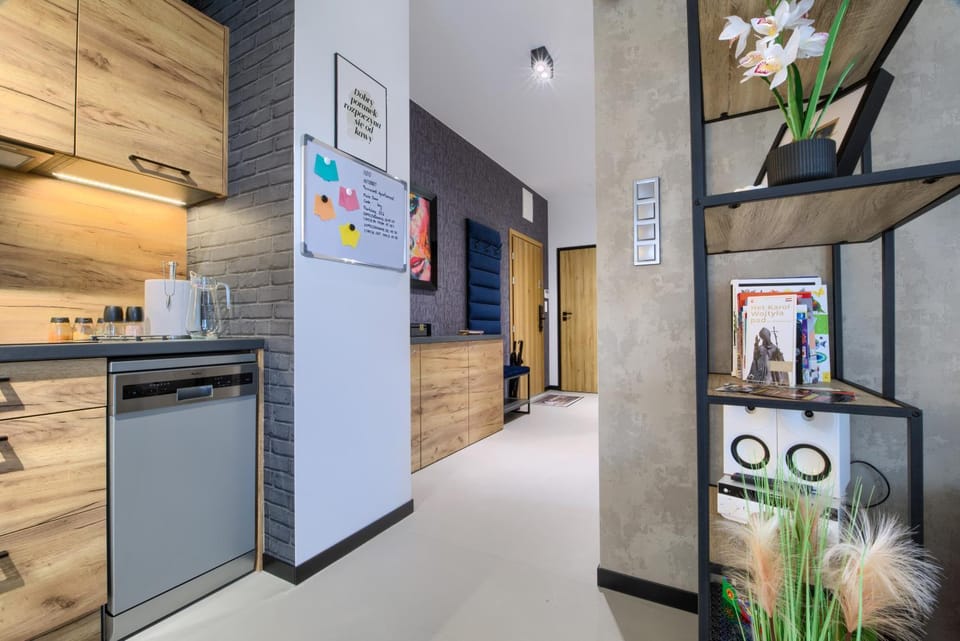 Kitchen or kitchenette, dishwasher, oven, stove