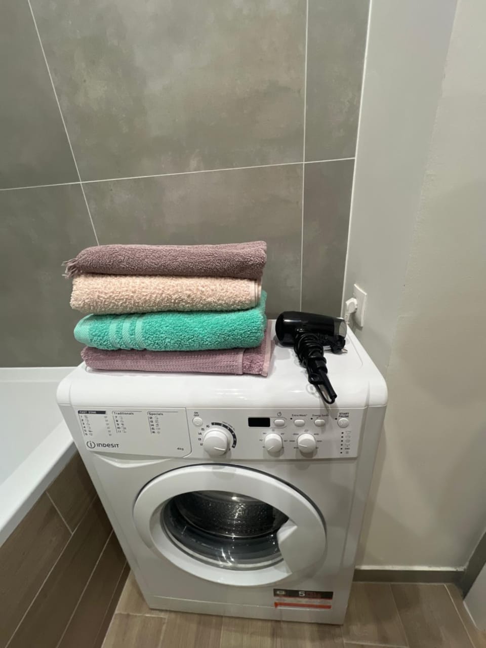 Bathroom, hair dryier, towels, washing machine, dryer