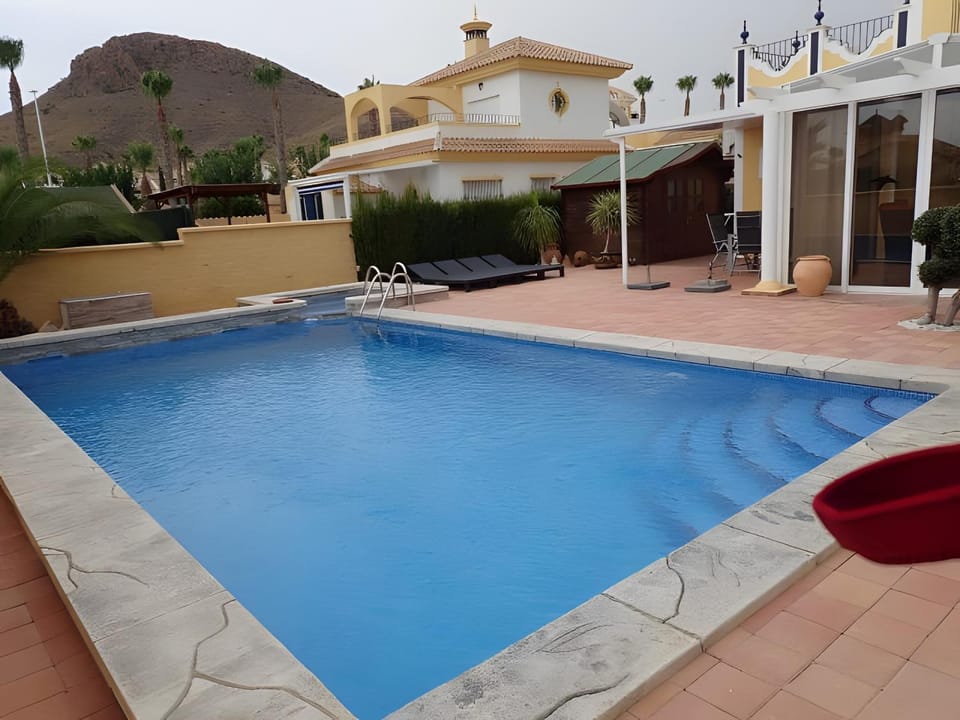 Property building, Living room, Swimming pool