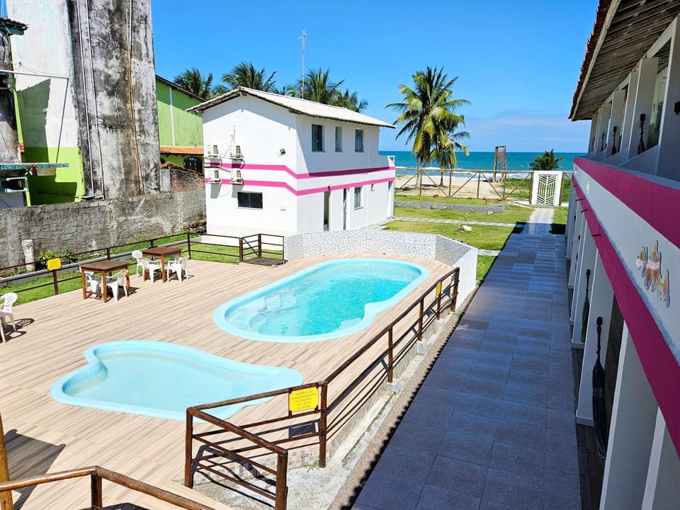 Property building, Day, Pool view, Swimming pool, sunbed