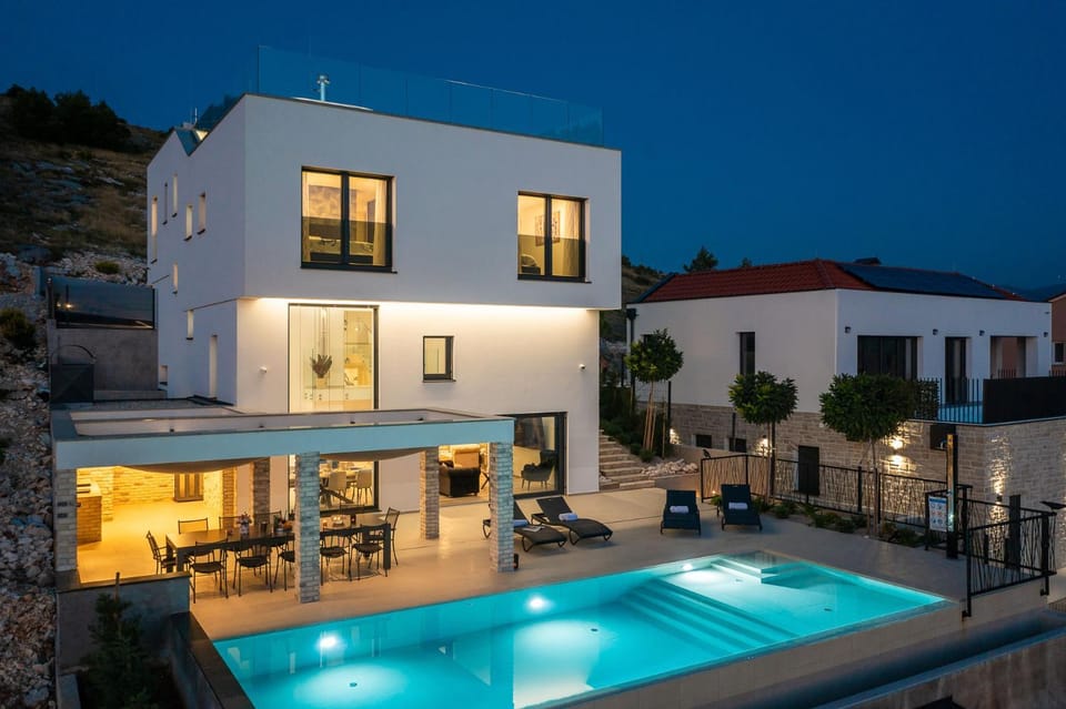 Property building, Patio, Night, Balcony/Terrace, Pool view, Swimming pool, Swimming pool, sunbed