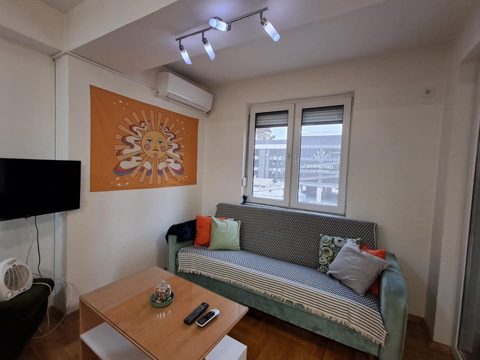 TV and multimedia, View (from property/room), Living room, Seating area, City view