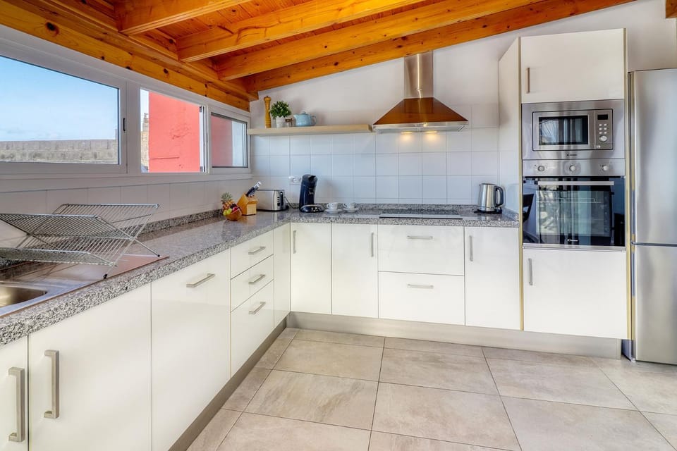 Kitchen or kitchenette, dishwasher, oven, stove