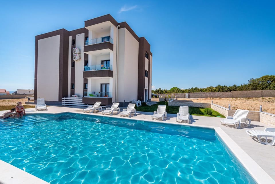 Property building, Pool view, Swimming pool, sunbed