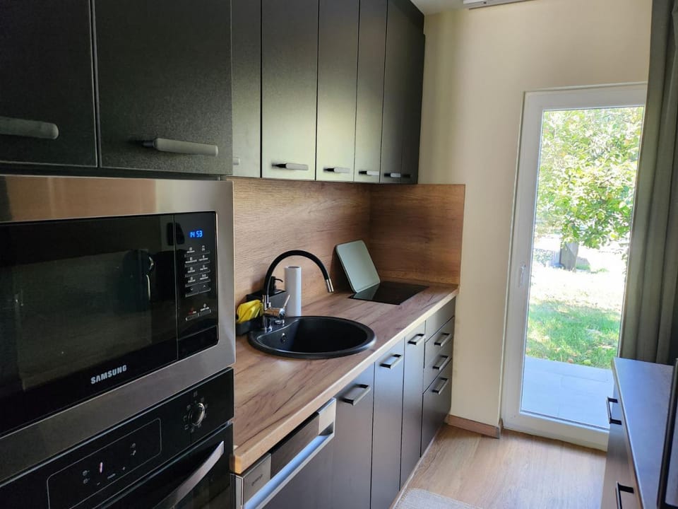 Kitchen or kitchenette, dishwasher, microwave, oven