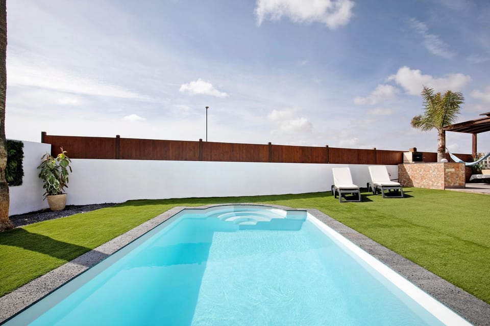 Property building, Living room, Swimming pool