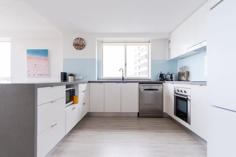 Kitchen or kitchenette, dishwasher, oven, stove, toaster