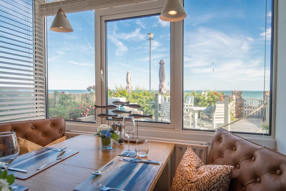 Natural landscape, View (from property/room), Living room, Seating area, Dining area, Sea view