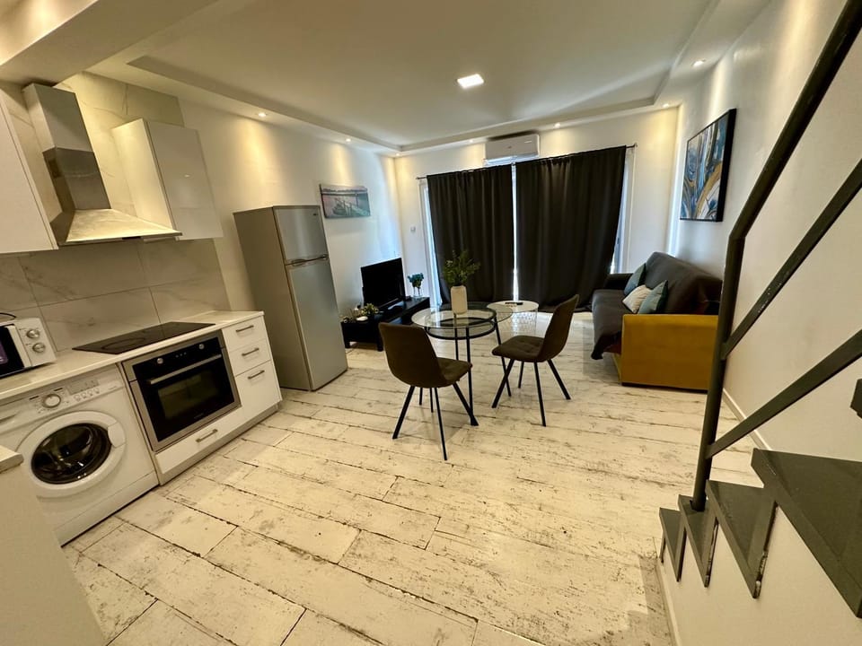 Kitchen or kitchenette, Living room, Seating area, oven, stove, washing machine