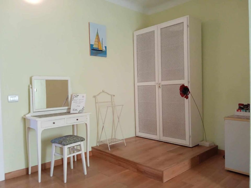 Bedroom, hair dryier, towels, wardrobe, air conditioner