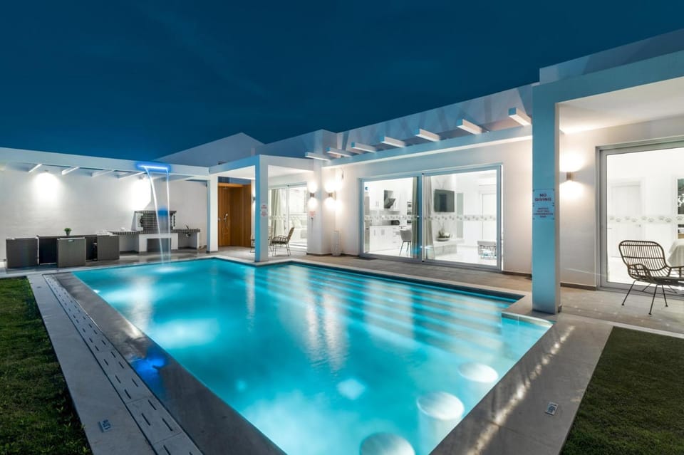 Property building, Patio, Night, BBQ facilities, Pool view, Swimming pool, sunbed
