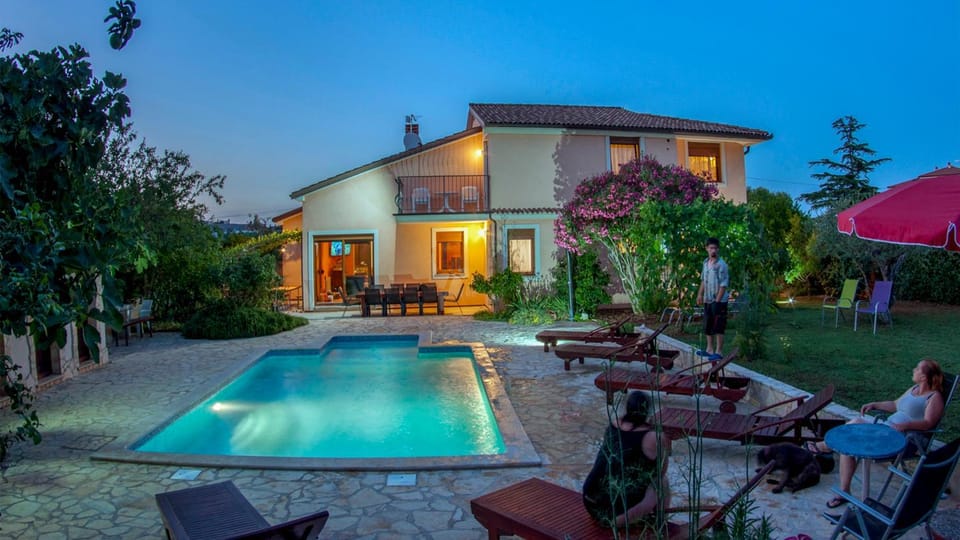 Property building, Patio, Night, Garden, Seating area, Garden view, Pool view, Swimming pool, sunbed
