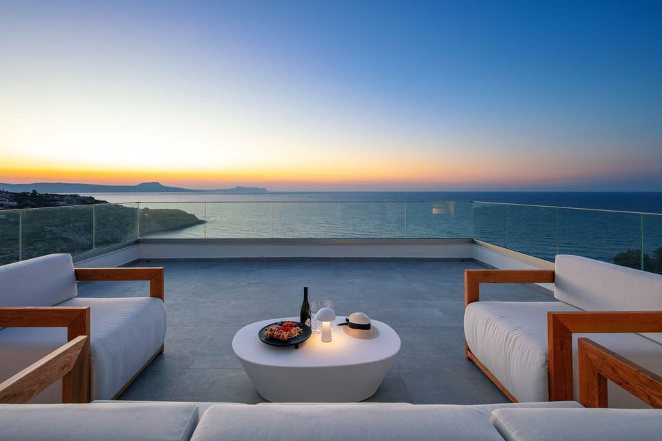 View (from property/room), Balcony/Terrace, Seating area, Mountain view, Sea view, Sunset