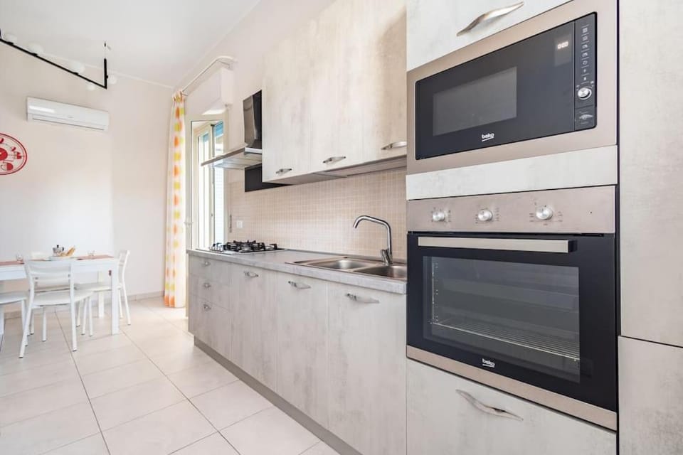 Kitchen or kitchenette, Dining area, dishwasher, oven, stove, air conditioner