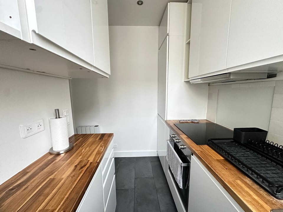 Kitchen or kitchenette, dishwasher, oven, stove