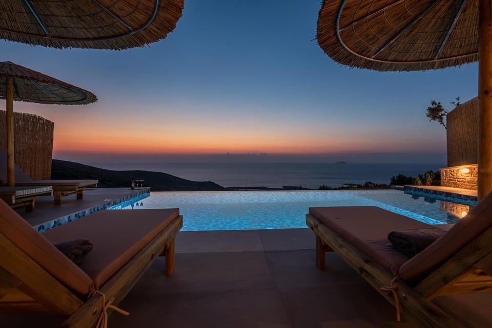 Patio, Nearby landmark, Night, Natural landscape, View (from property/room), Balcony/Terrace, Living room, Seating area, Mountain view, Pool view, Sea view, Swimming pool, Sunset, sunbed