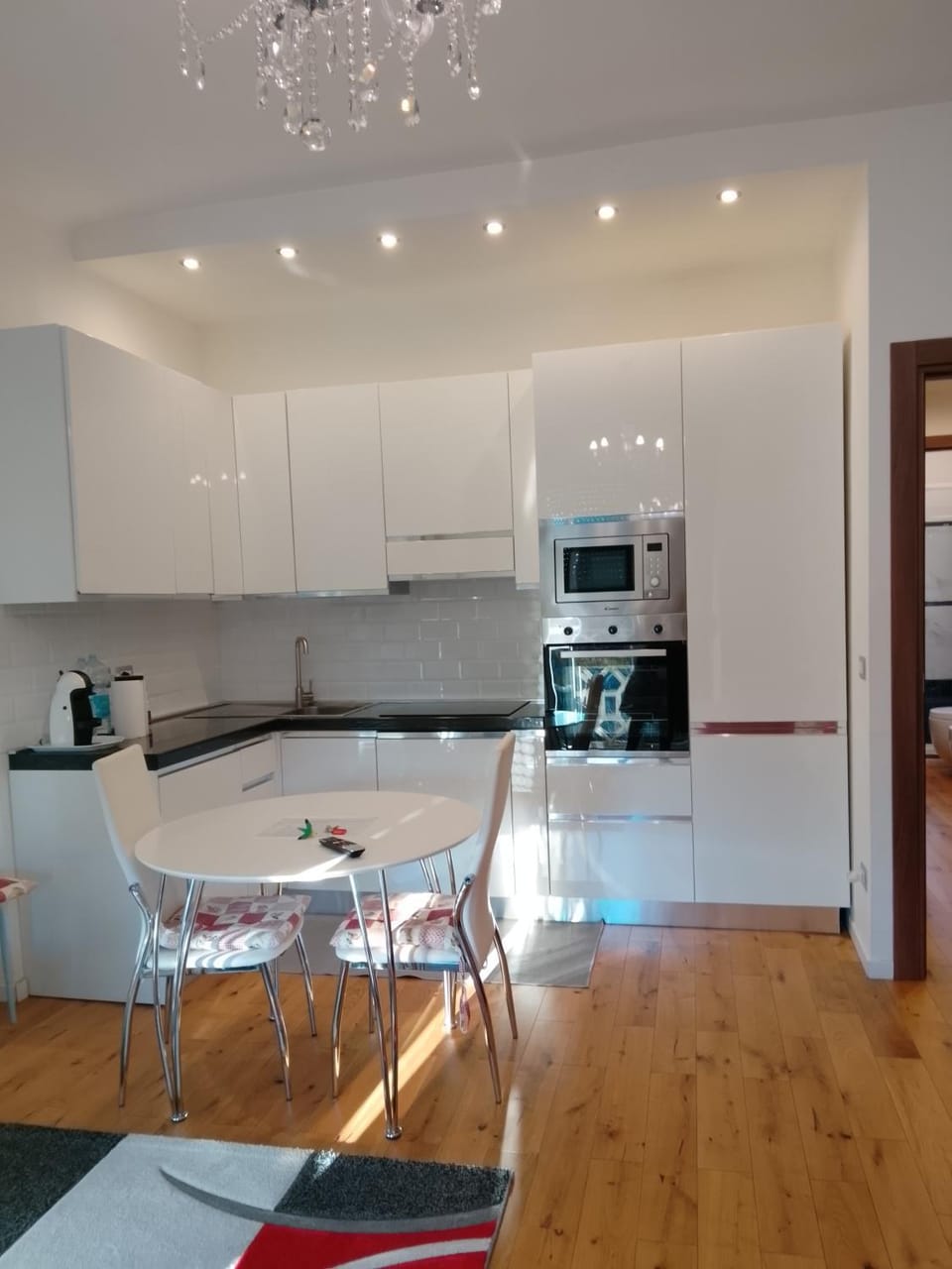 Kitchen or kitchenette, Living room, Seating area, Dining area, dishwasher, stove, toaster, washing machine