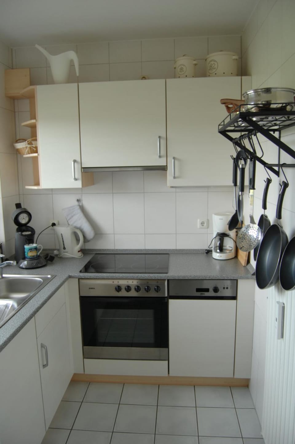 Kitchen or kitchenette, dishwasher, oven, stove, toaster