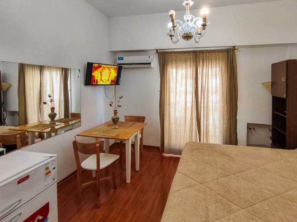 Bed, TV and multimedia, Photo of the whole room, Seating area, Dining area, Bedroom, wardrobe, air conditioner