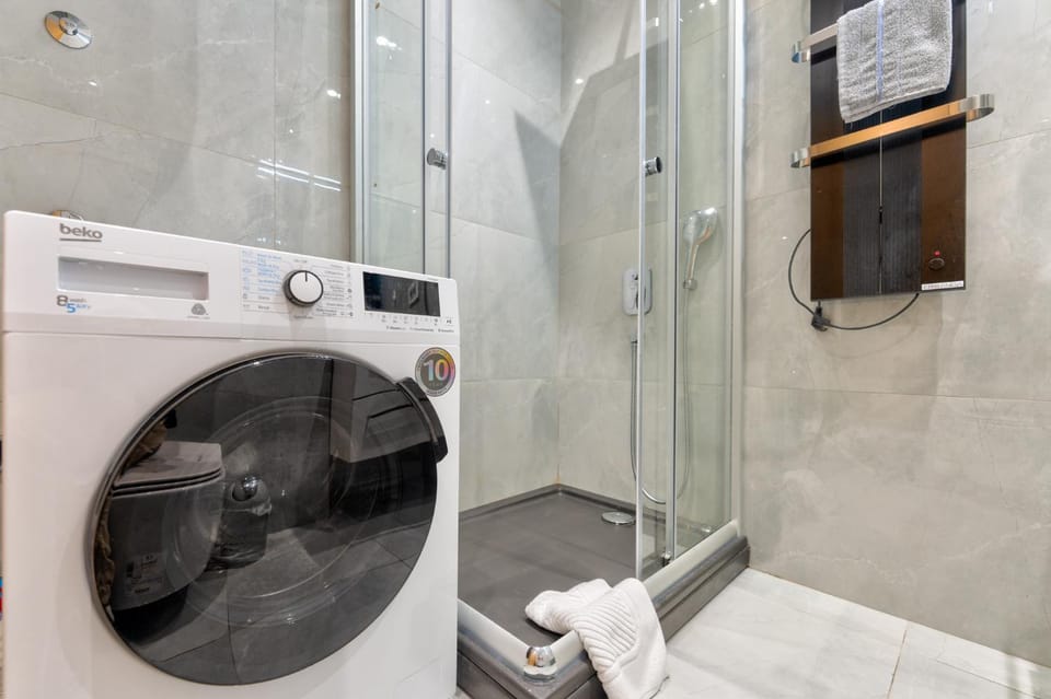 Shower, Toilet, Bathroom, towels, washing machine, dryer