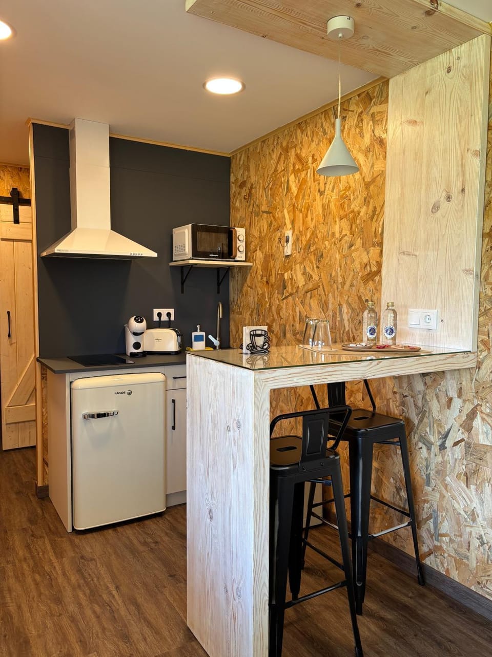 Kitchen or kitchenette, microwave, stove, toaster