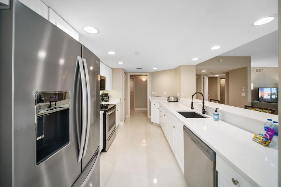 Kitchen or kitchenette, dishwasher, oven, stove