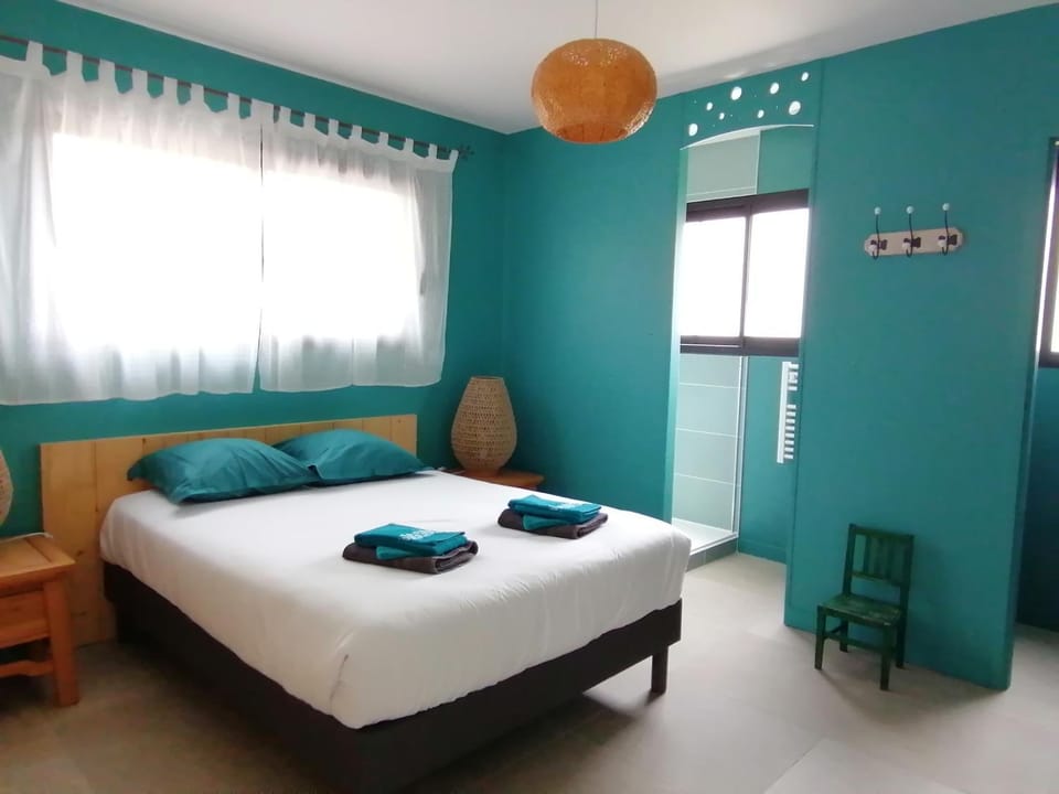Bed, Photo of the whole room, Bedroom, hair dryier, towels