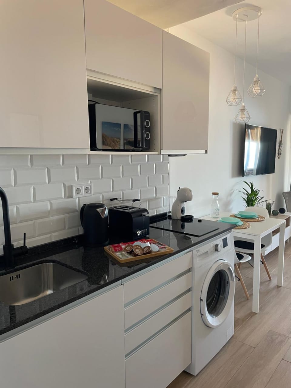 Kitchen or kitchenette, stove, washing machine