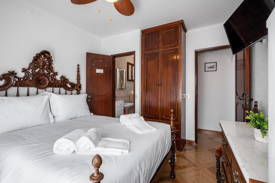 Bed, towels, wardrobe