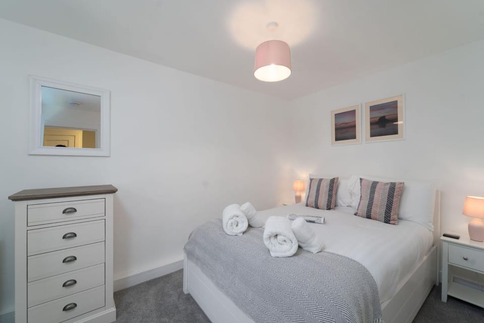 Bedroom, hair dryier, storage, towels, wardrobe
