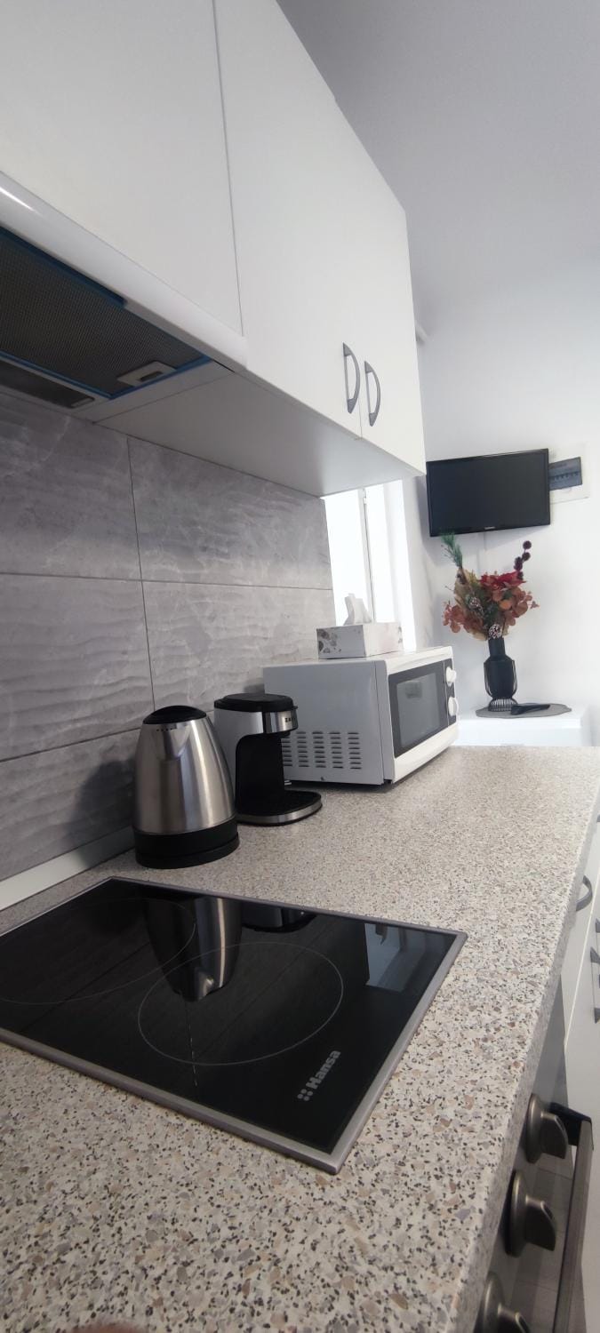 Kitchen or kitchenette, microwave, stove, toaster, kitchen