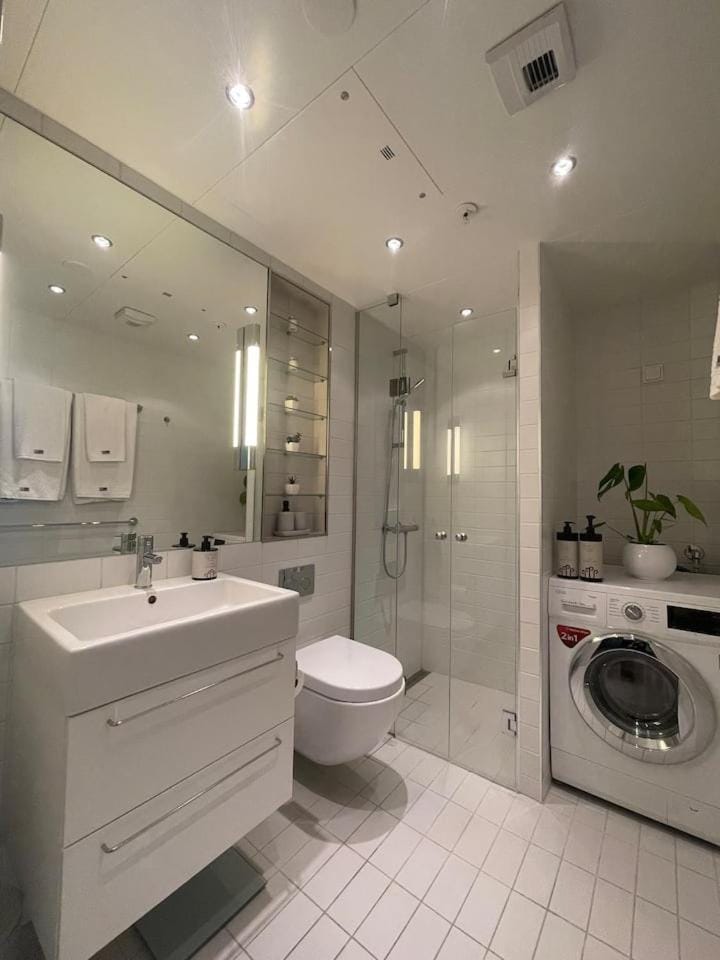Shower, Toilet, Bathroom, towels, washing machine, dryer
