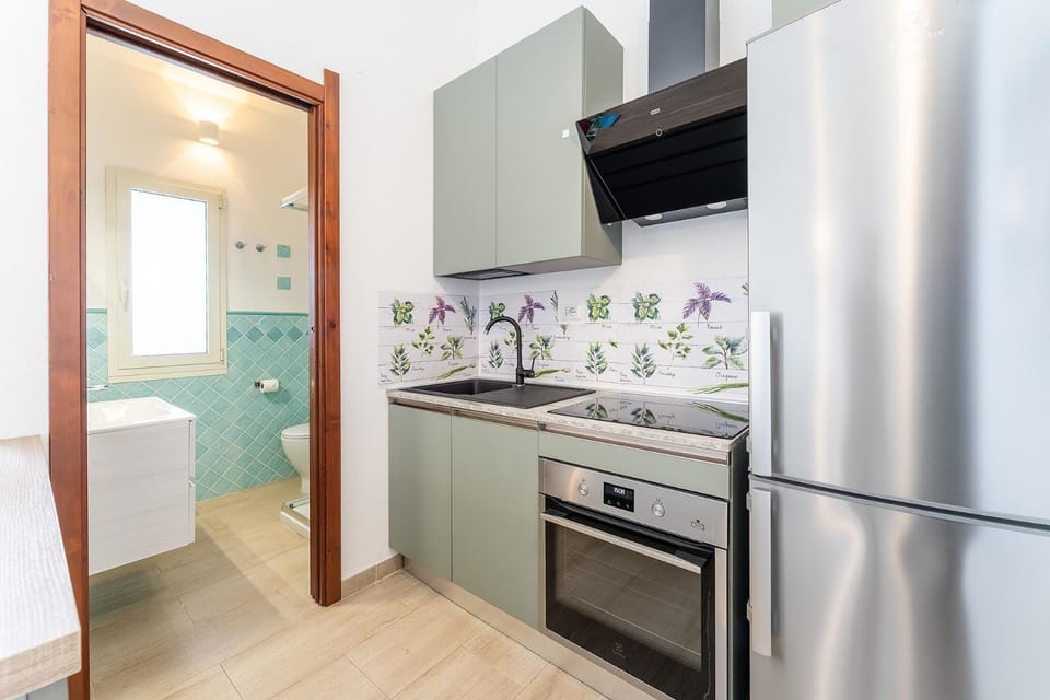 Kitchen or kitchenette, dishwasher, oven, stove