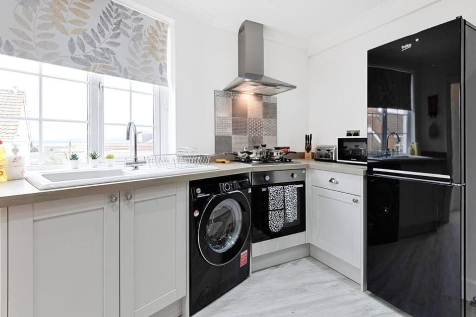Kitchen or kitchenette, washing machine