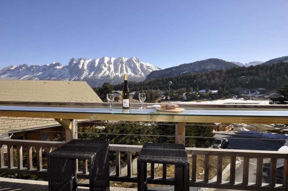Property building, Nearby landmark, Natural landscape, Winter, View (from property/room), Balcony/Terrace, Dining area, Food, Mountain view, Drinks, Alcoholic drinks