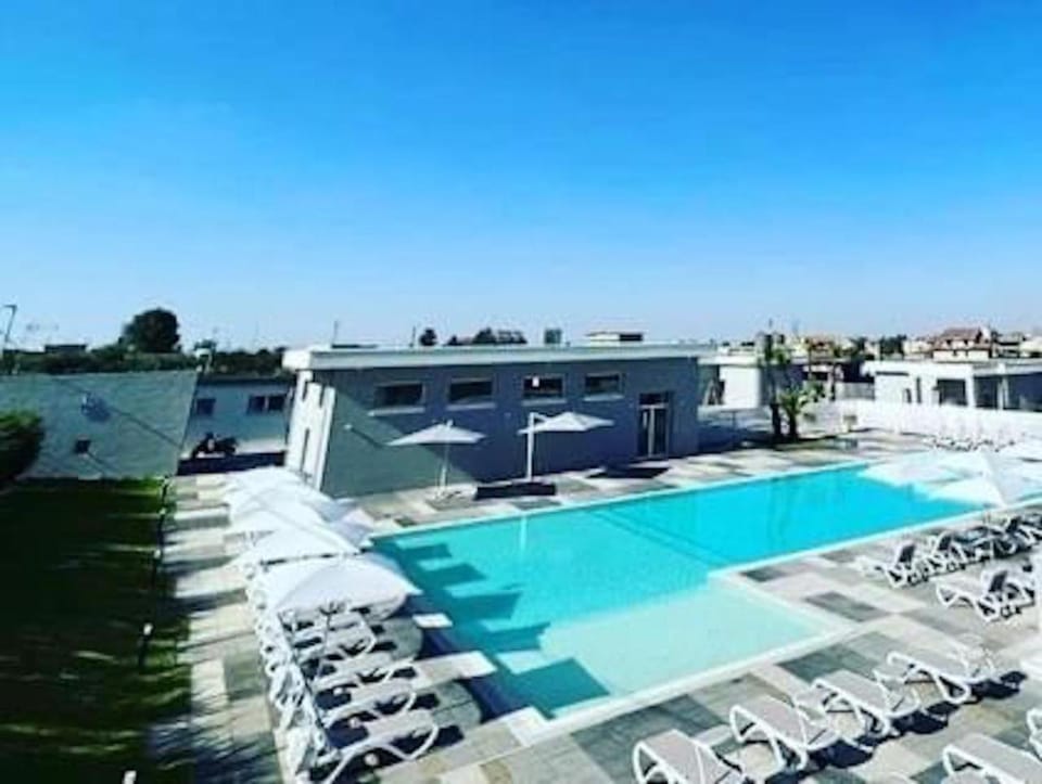 Property building, Pool view, Swimming pool, sunbed