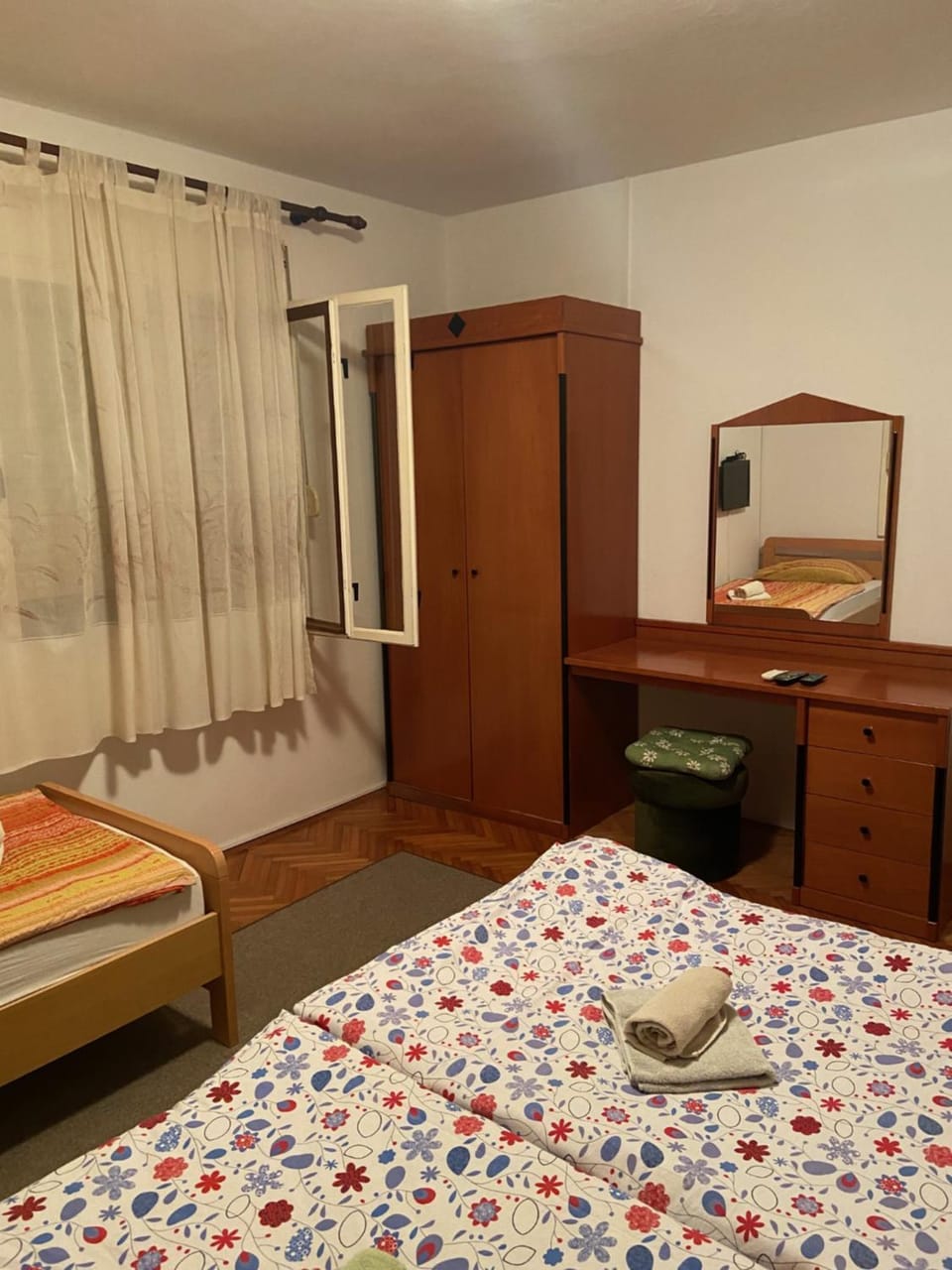 Bed, hair dresser, towels, wardrobe