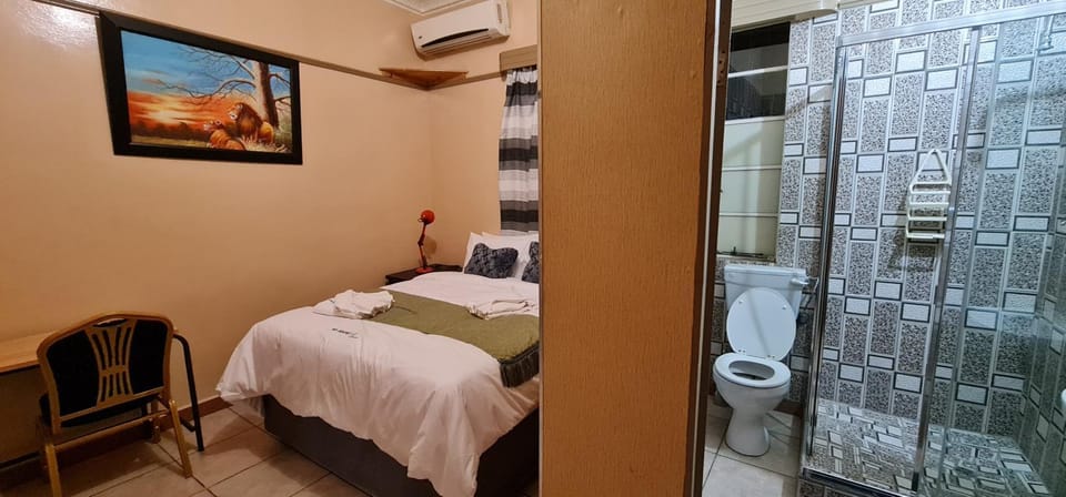 Shower, Bed, Bathroom, Photo of the whole room, Bedroom, towels, air conditioner
