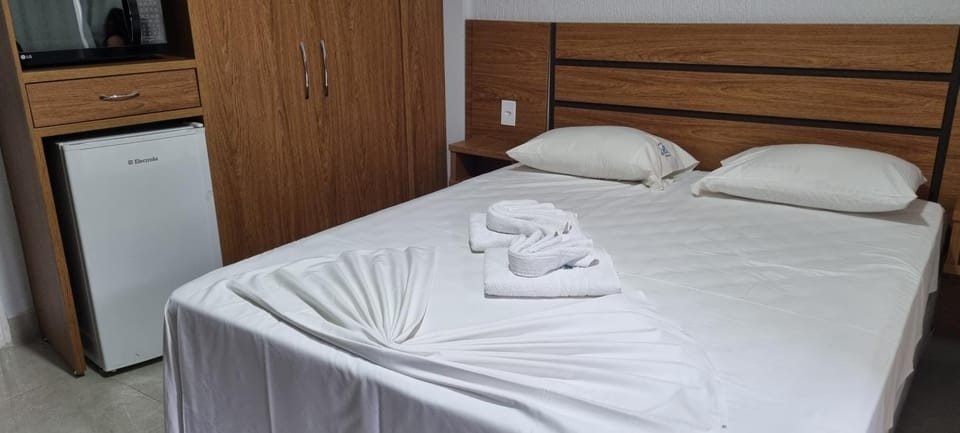 Bed, towels, wardrobe