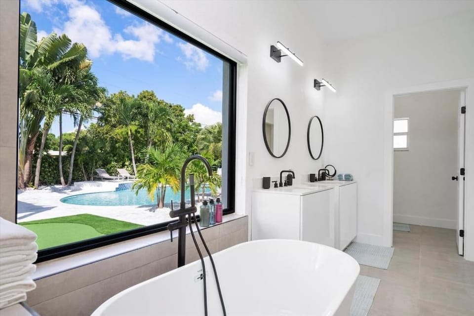 VillaLee-Jungle Palm Island white marble pool Area House in Golden Glades