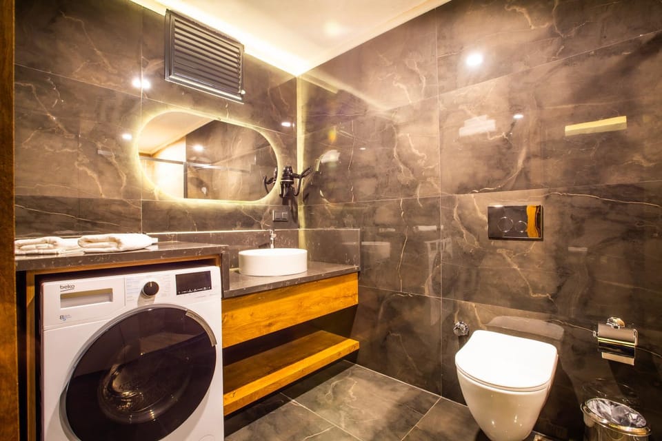 Shower, Toilet, Bathroom, towels, washing machine, dryer