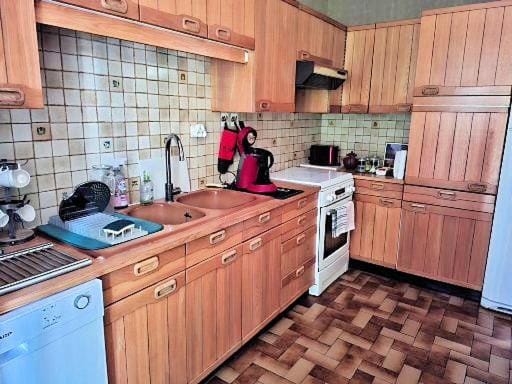 Kitchen or kitchenette, dishwasher, oven, stove, toaster