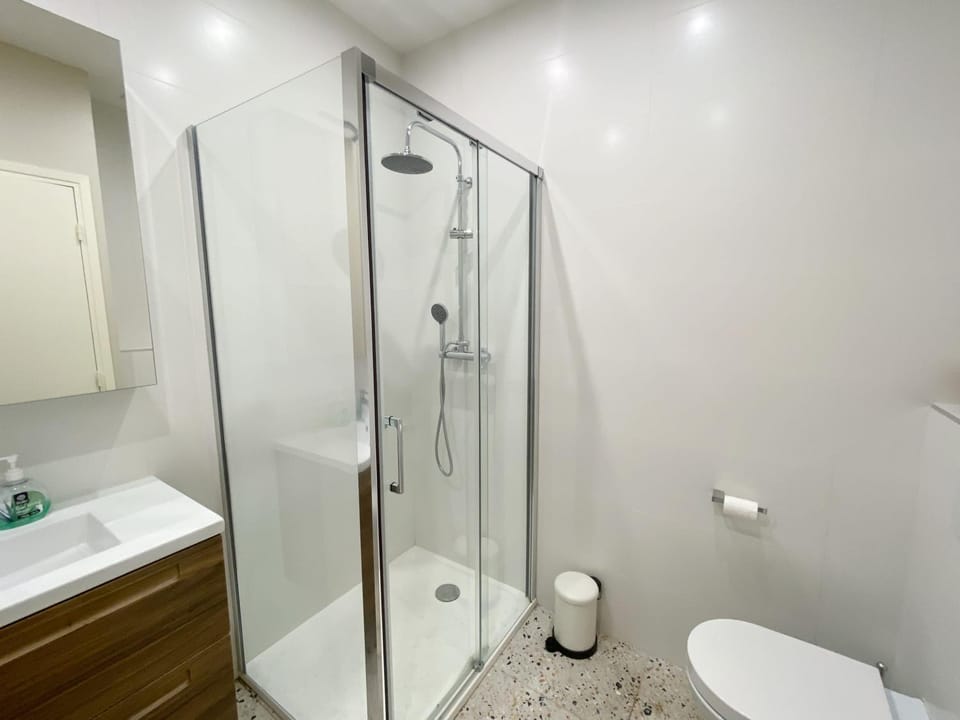 Shower, Toilet, Bathroom, hair dryier, towels